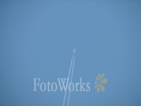 Aircraft and white trace